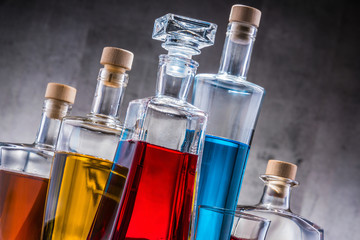Carafe and bottles of assorted alcoholic beverages.