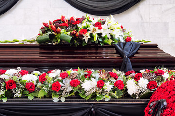 Funeral, beautifully decorated with flower arrangements coffin, close-up