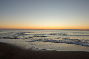 Sunrise on a beach of the mediterranean sea