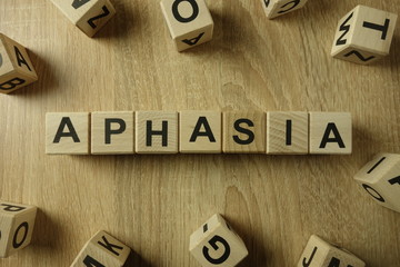 Aphasia word from wooden blocks on desk