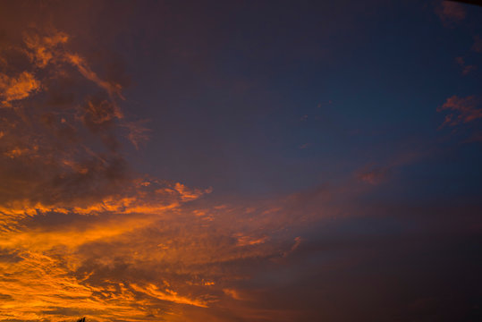 Golden blue hours burning cloudy sky sunset high resolution image