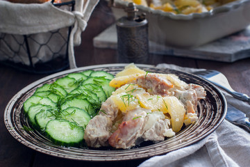 Roast pork with potatoes, selective focus