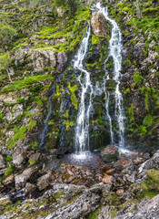 Moss Force Waterfall at Newlands Hause in the Lake District. Part of Alfred Wainwright's memorial walk they total 100 meters (328 ft) high and are between Buttermere and Keswick