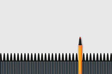 Business Leadership Concept : Yellow magic pen standing out from row of many black magic pens on gray background.