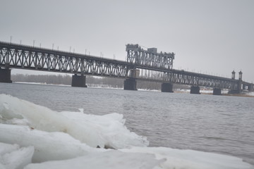  Dangerous bridge over the river. Winter
