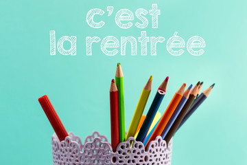 Concept back to school translated in french with Coloured pencils and 