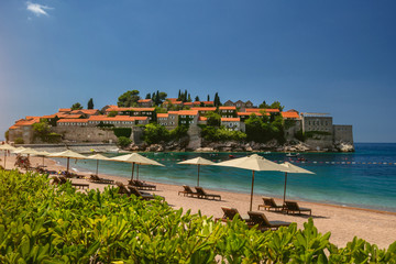 Parasol and a beautiful beach on the Adriatic Sea. Montenegro.