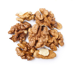 A pile of walnut kernels isolated on white background.