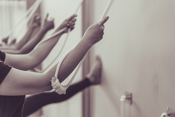 Young woman practicing yoga with namaste behind the back.working out, wearing sportswear.Calmness and relax, woman happiness. Toned picture