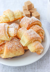 Cheese bagels with powdered sugar.