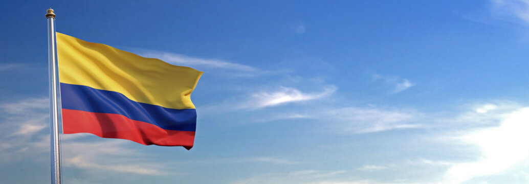 Bandera de Colombia subida ondeando al viento con cielo de fondo