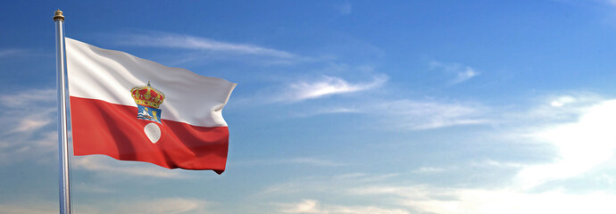 Bandera de Cantabria subida ondeando al viento con cielo de fondo