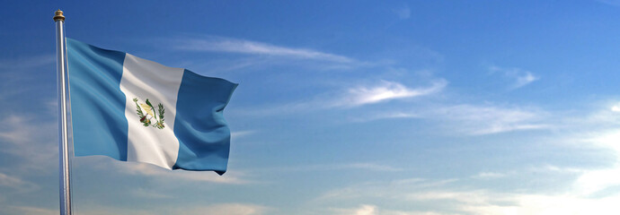 Bandera de Guatemala subida ondeando al viento con cielo de fondo - obrazy, fototapety, plakaty