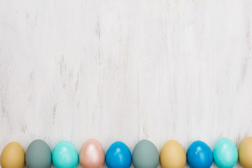 easter eggs on white wooden background
