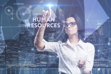 The concept of business, technology, the Internet and the network. A young entrepreneur working on a virtual screen of the future and sees the inscription: Human resources