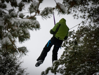 A persone on the rope. It is extreme winter activity