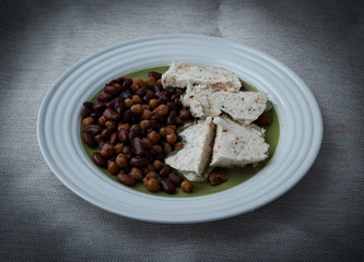 Plate with a diet food. Beans, chickpeas and chicken cutlet