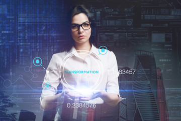 The concept of business, technology, the Internet and the network. A young entrepreneur working on a virtual screen of the future and sees the inscription: Transformation