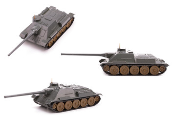 World war II toy tank isolate on white background. Toy green tank made of metal.