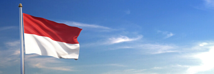 Flag of Indonesia rise waving to the wind with sky in the background