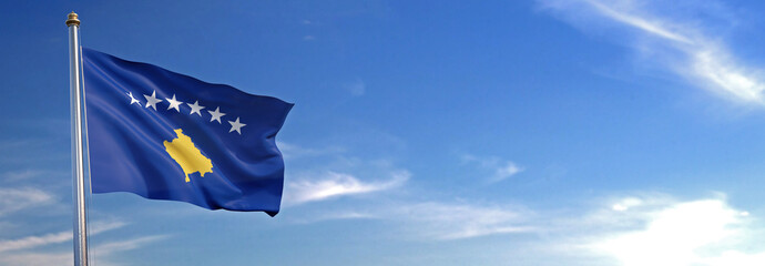 Flag of Kosovo rise waving to the wind with sky in the background