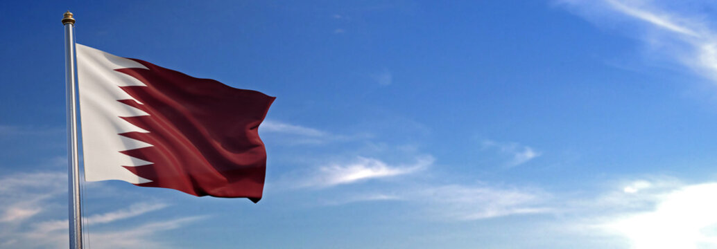 Flag of Qatar rise waving to the wind with sky in the background