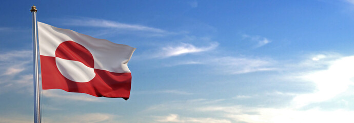 Flag of Greenland rise waving to the wind with sky in the background