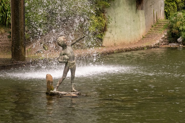 Botanical Gardens Statue in cascade from waterfall