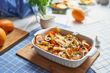 vegetarian roast without meat with pumpkin, potatoes and mushrooms; pumpkin dish