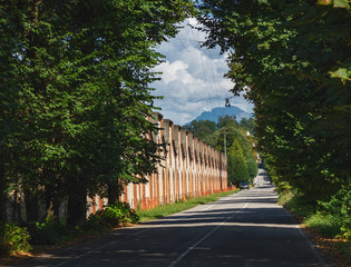 Fototapeta na wymiar Crespi d'Adda - Lombardy Unesco site. the main road that crosses the working village.