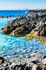 Lagoon with turquoise clear water in Playa Jablillo beach, in Costa Teguise, Lanzarote, Canary islands, selective focus
