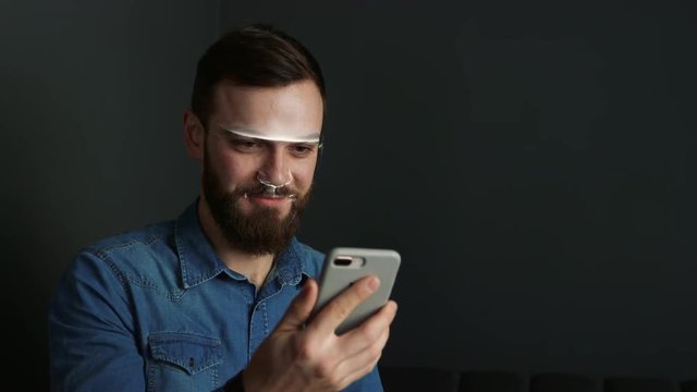 man scans the face with the phone. Face ID