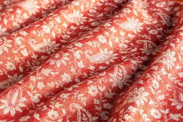 Traditional oriental fabric background. Arabic pattern on fabric. Folds in the cloth.