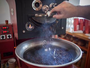 roasting and mixing roasted coffee in a roaster