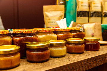 Fototapeta na wymiar Homemade jam and farm honey on the market