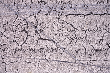 close up of cracked paint on the street for backgrounds
