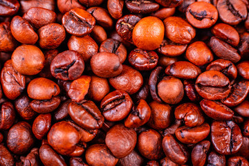 Seeds of fragrant coffee on a dark concrete background. It can be used as a background