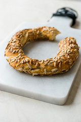 Turkish Bagel Simit with Sunflower / Kernel Seeds on Marble Board.