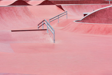 Red platform for riding people on skateboard and roller skates in city park. © Evgenii