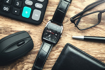 Men's accessories on the wood background.