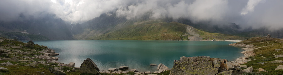 Mountain lake panorama in a cloudy day