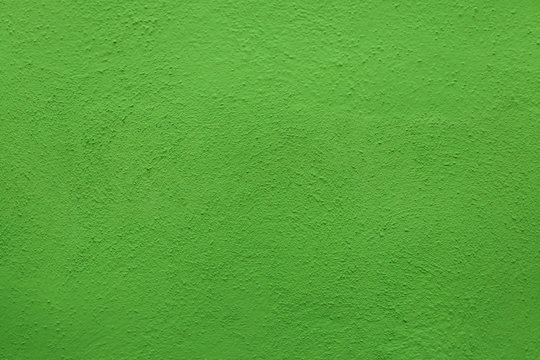 Green painted stucco wall. Background texture.