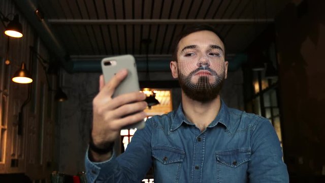 man scans the face with the phone. Face ID