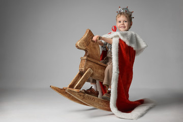 Little boy playing knight