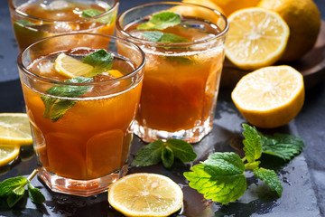 refreshing iced tea with mint and lemon, closeup