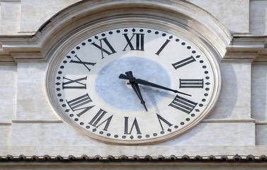 Fototapeta na wymiar Clock on Tower of Palazzo Montecitorio, seat of the Italian Chamber of Deputies in Rome, Italy 