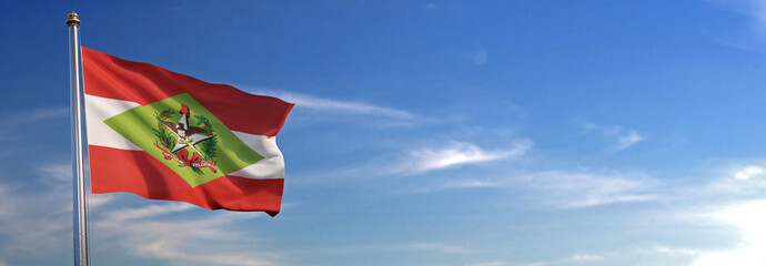 Bandeira do Santa Catarina subir acenando para o vento com o céu ao fundo © Negro Elkha