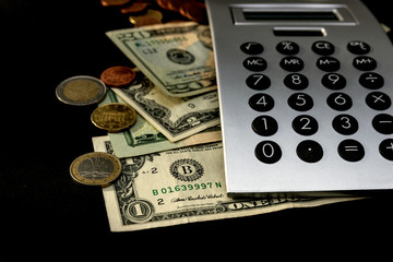 Fototapeta premium Money and Calculator, business concept. American dollars counting cash.