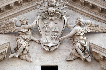 Coat of arms of Pope Alexander VII Chigi on the portal of Sant Andrea della Valle Church in Rome, Italy 
