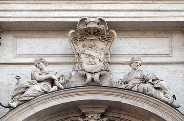 Fototapeta na wymiar Coat of arms of Cardinal Francesco Peretti on the portal of Sant Andrea della Valle Church in Rome, Italy 